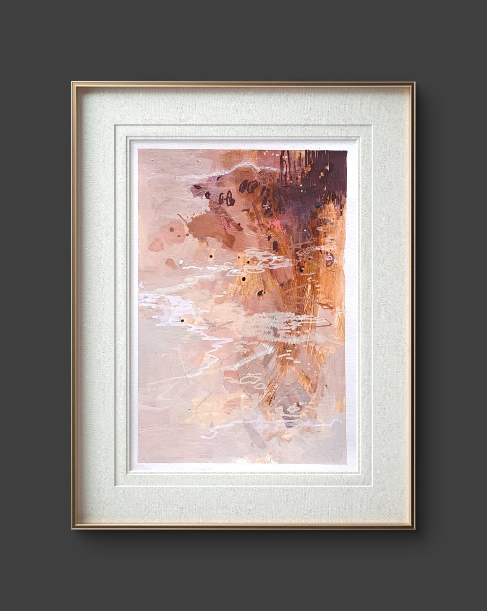 Framed abstract art print with a gold frame on a dark gray background