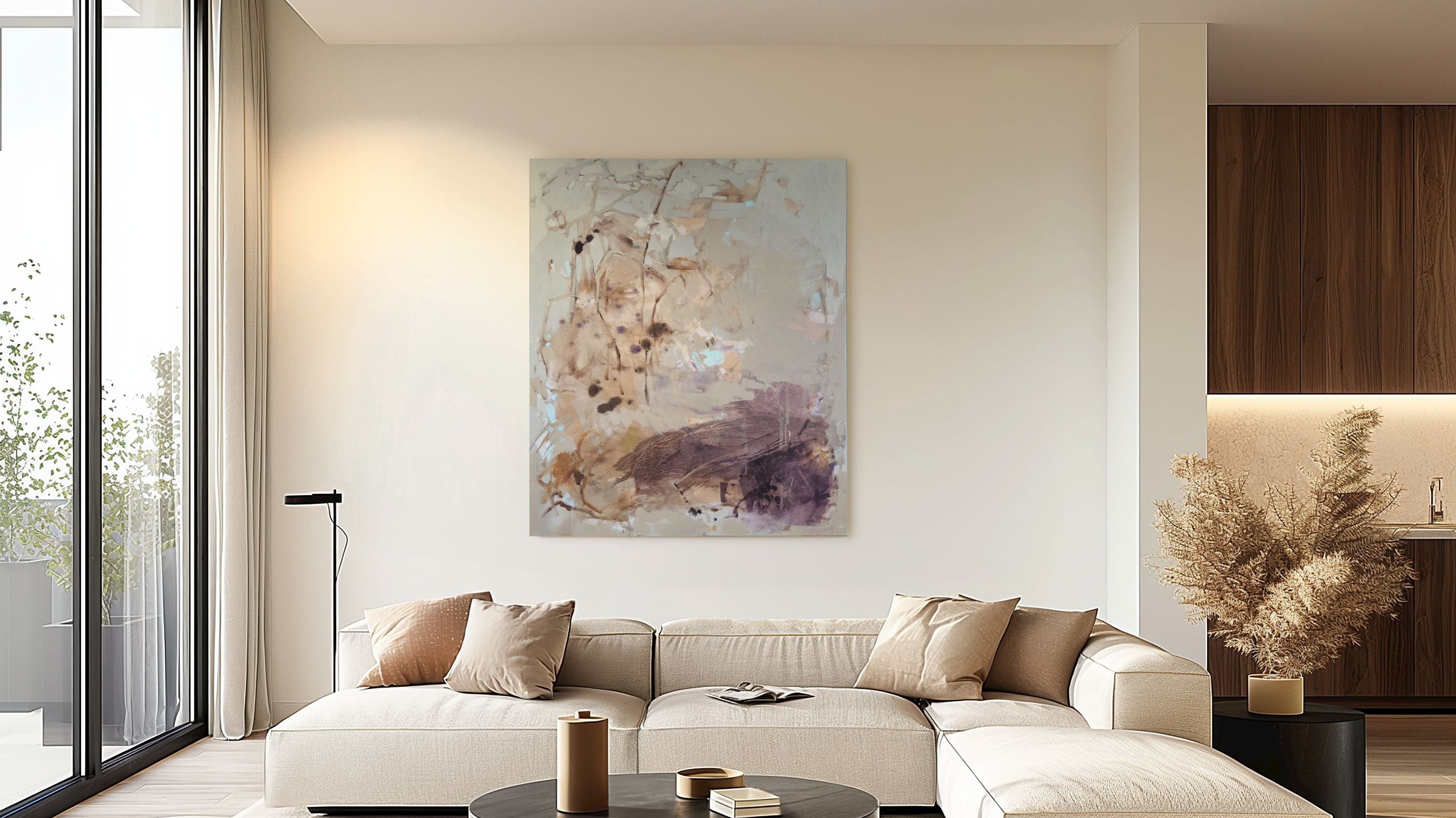 Modern living room with a white sofa, coffee table, and decorative wall art.
