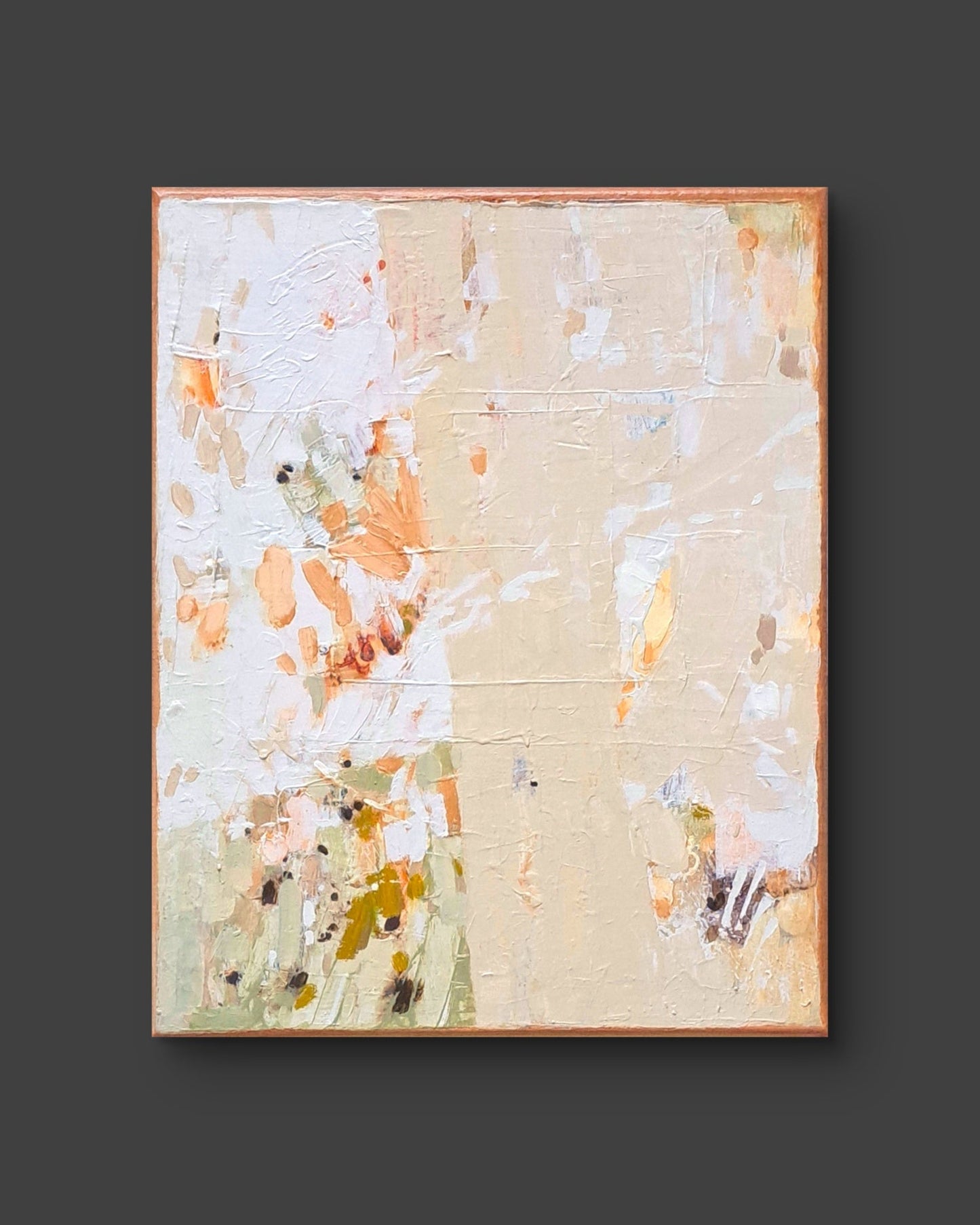 Abstract painting with splashes of orange, white, and beige on a dark background