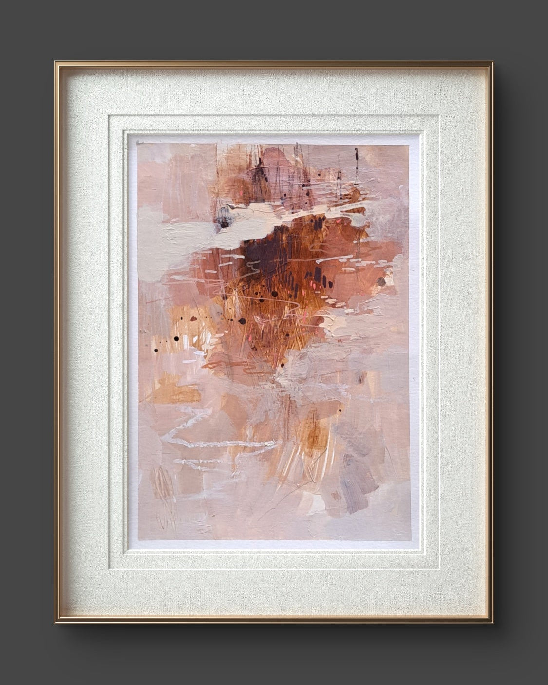 Framed abstract art piece on a dark gray wall