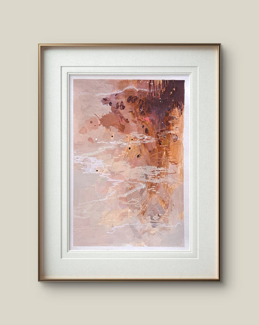 Framed pink abstract art print on a beige wall