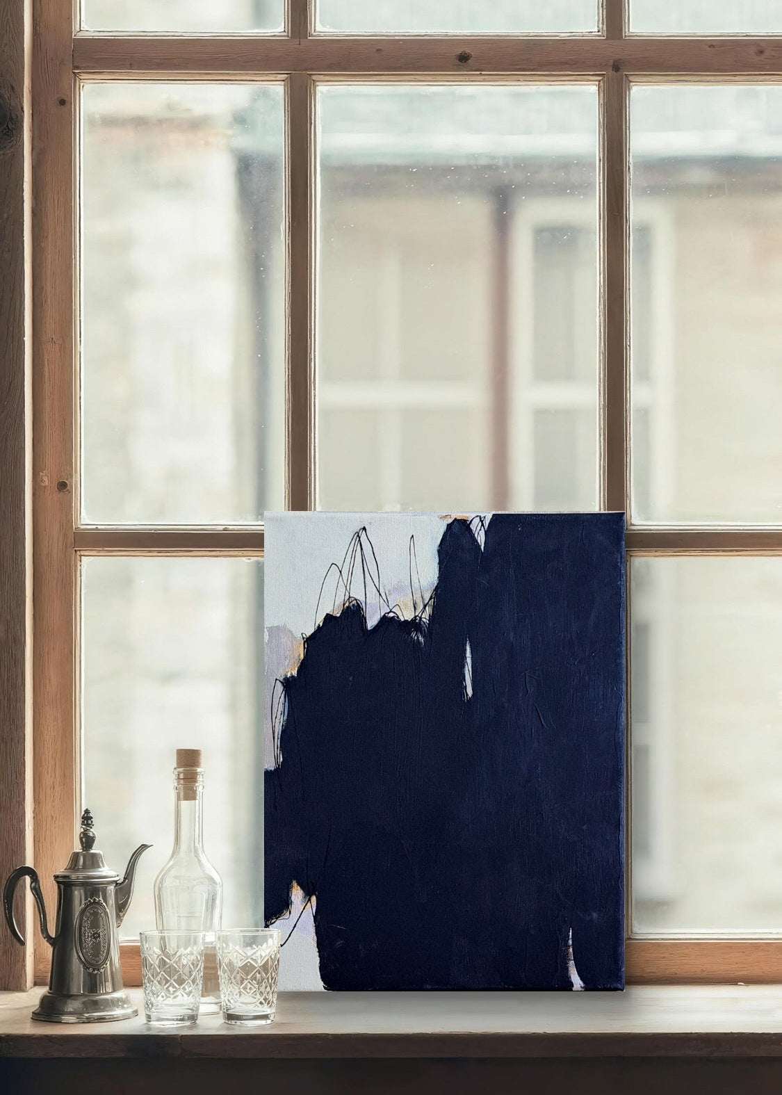 Abstract painting on a window sill with bottles and a teapot.